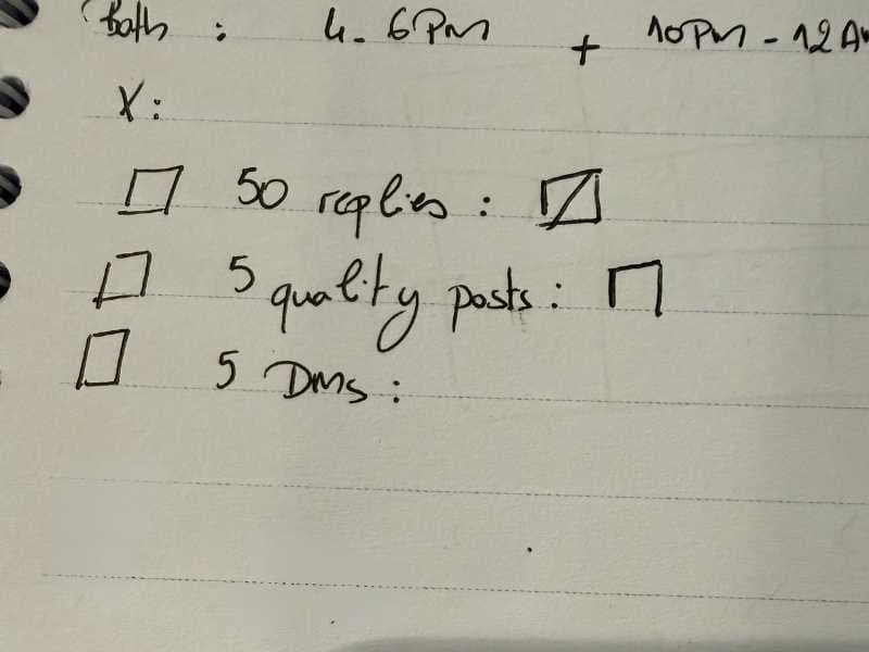 Paper ledger with daily distribution targets: 50 replies, 5 quality posts, 5 DMs